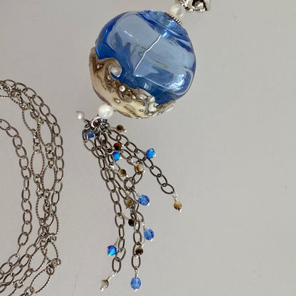 Closeup handmade glass bead and tassel  pendant / beach day / Arpaia